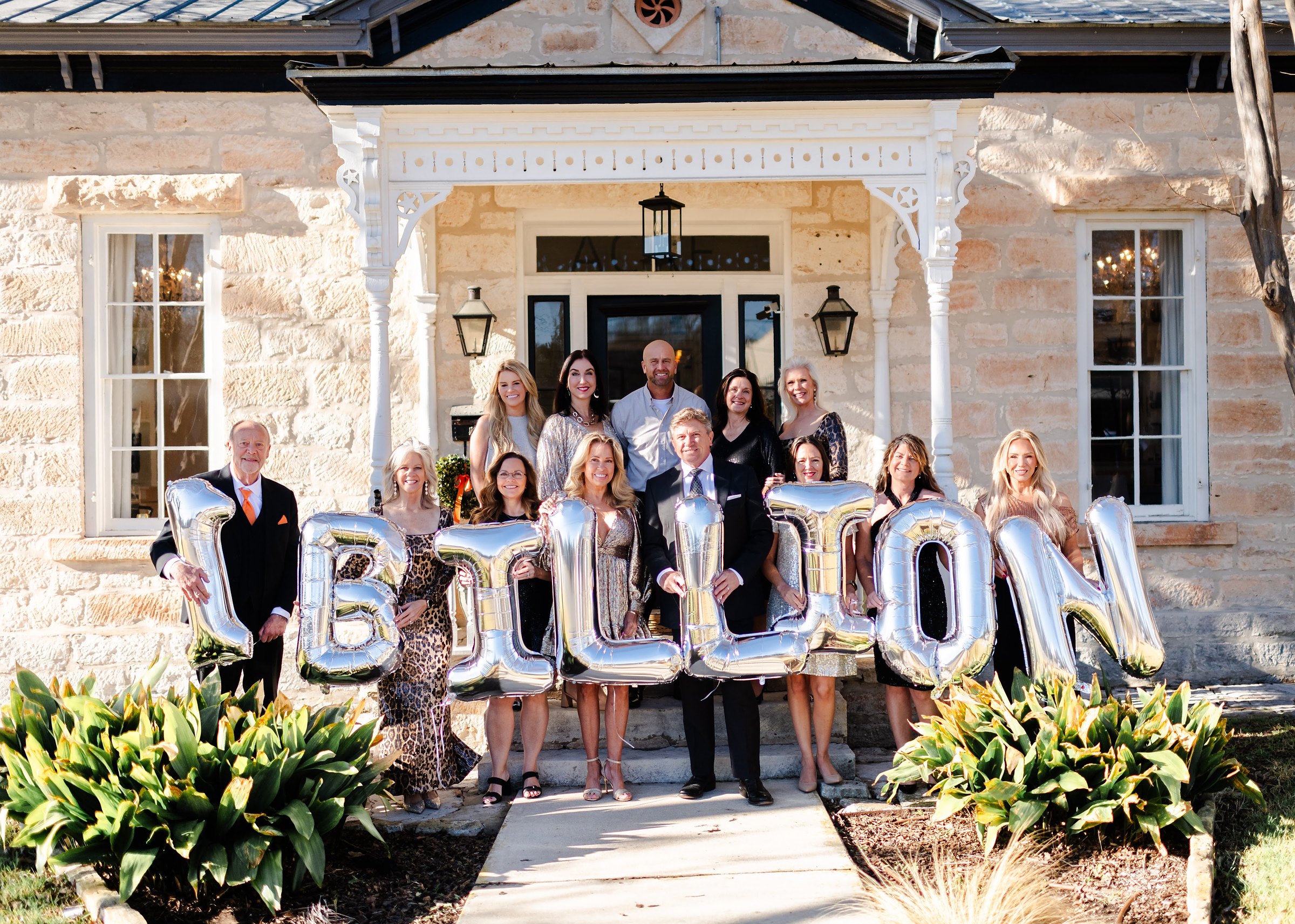 Absolute Charm Real Estate Group team celebrating $1 billion in sales