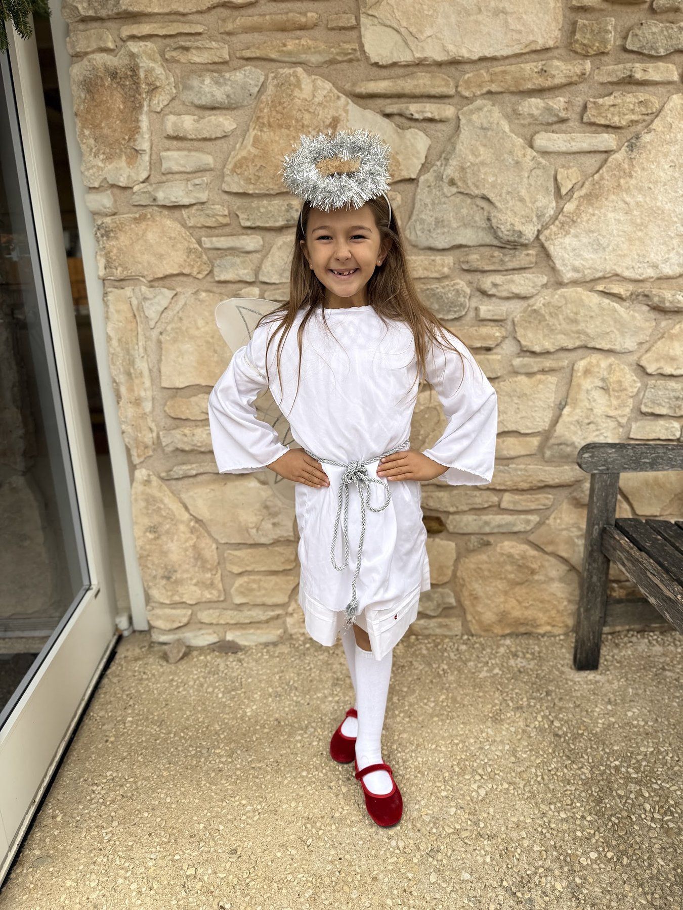 A child dressed as an angel for the Christmas pageant at St. Barnabas