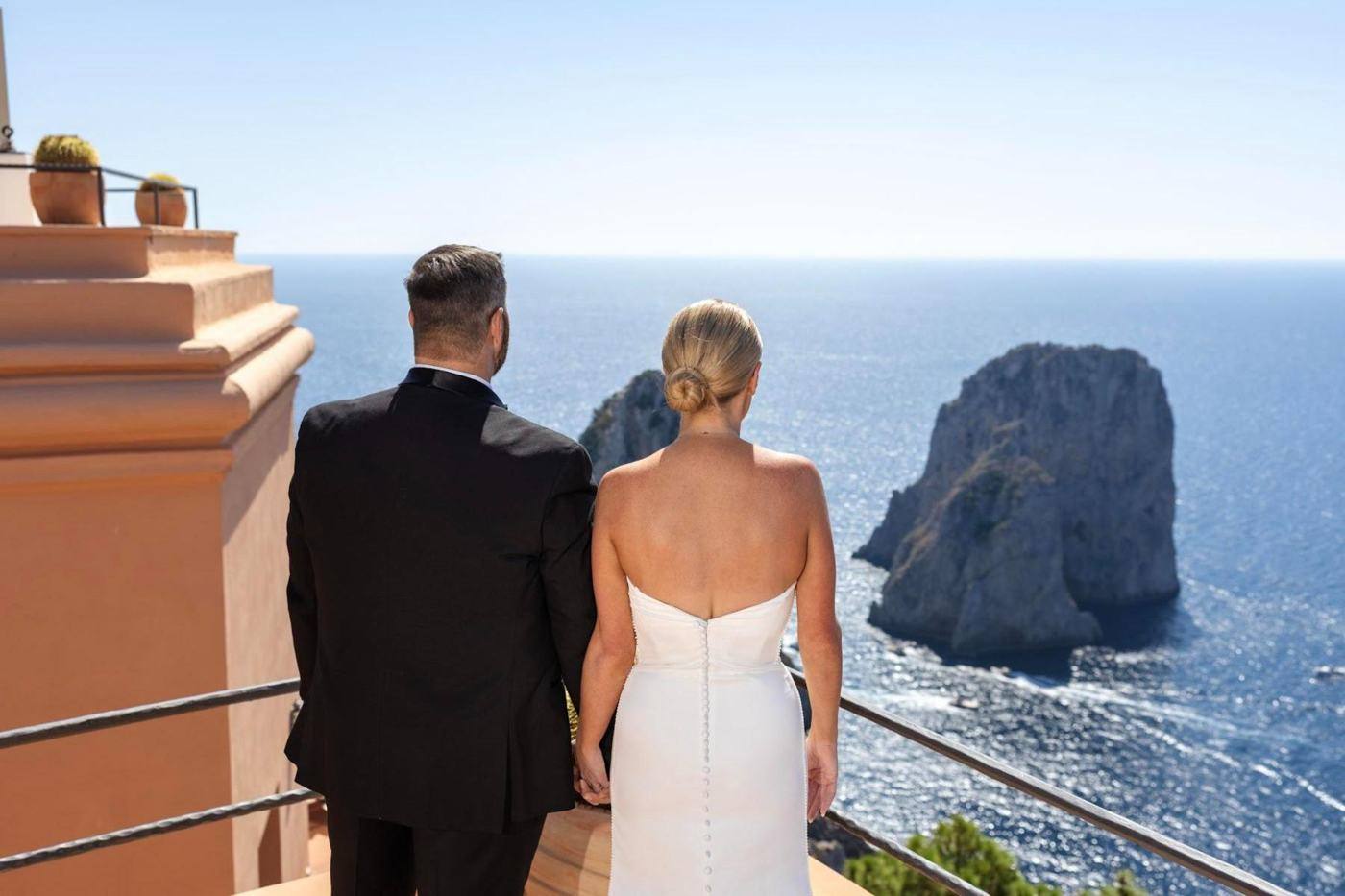 Savannah and David looking out at the Faraglioni rocks in Capri