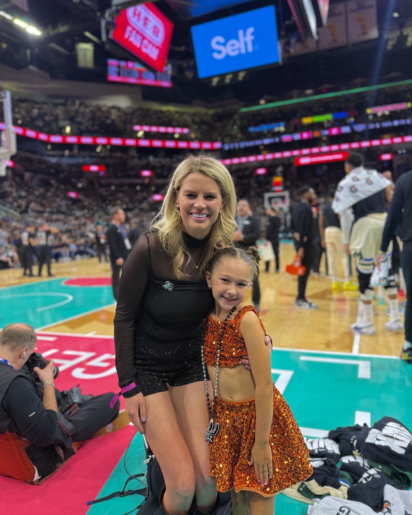 Savannah Sikes courtside at a Spurs game