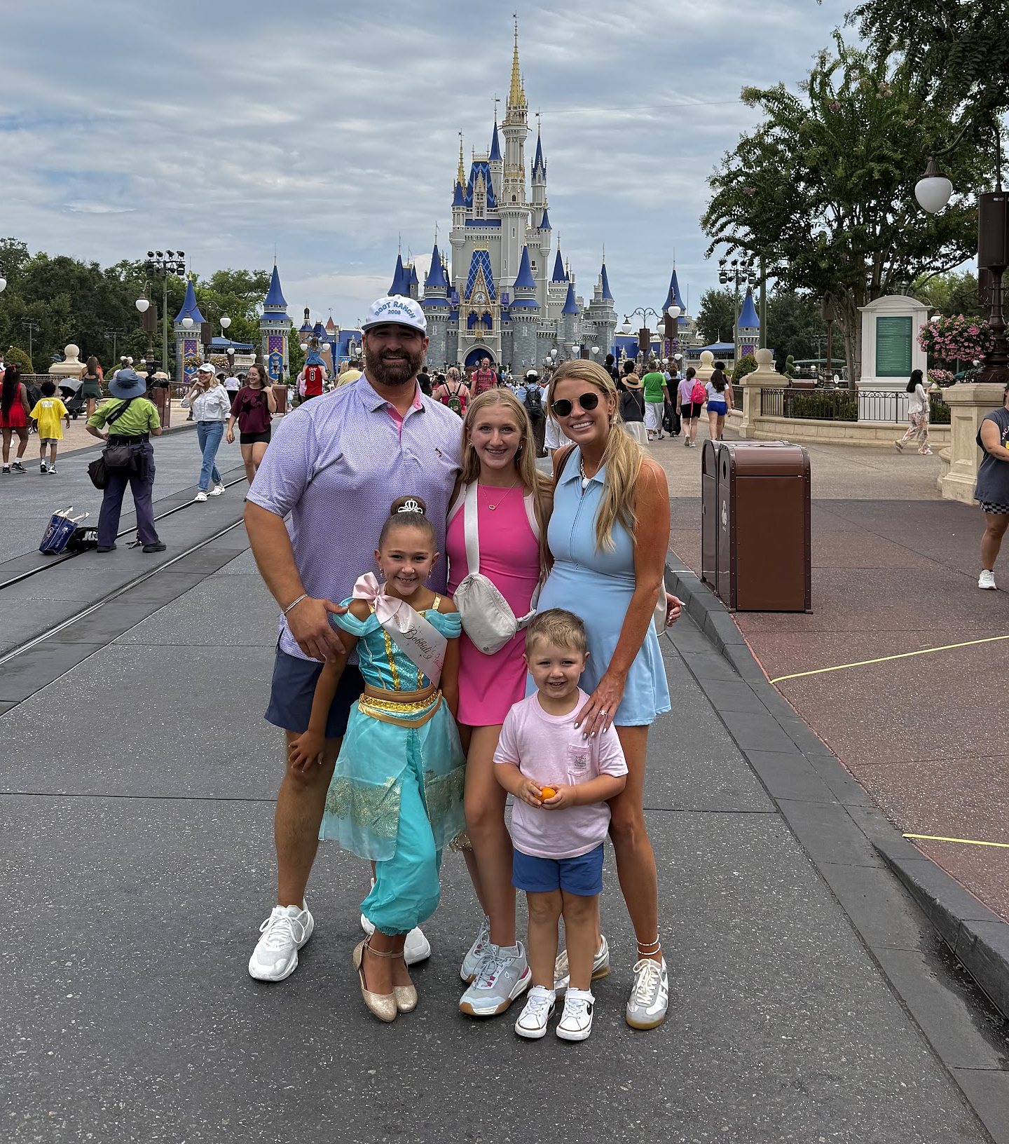 Savannah Sikes and her family in front of Cinderella Castle at Disney World