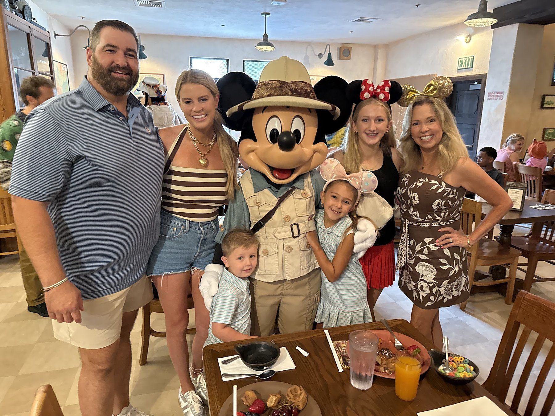 Savannah Sikes and her family with Mickey Mouse at a Disney character meal